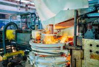 aap-causes-of-premature-bearing-failure-in-high-temperature-applications-1792595099 Fiery glassmaking process in a Dar es Salaam factory showcasing industrial machinery.