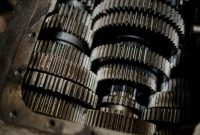 Detailed shot of mechanical gears showcasing intricate steel parts and engineering precision.